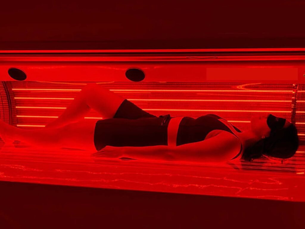 Red Light Therapy session promoting pain relief, tissue healing, and muscle recovery through advanced light technology.