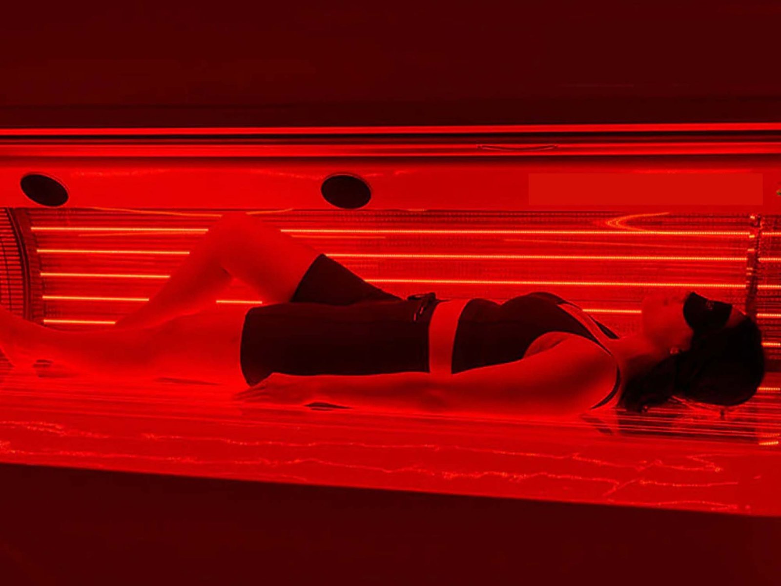 Red Light Therapy session promoting pain relief, tissue healing, and muscle recovery through advanced light technology.